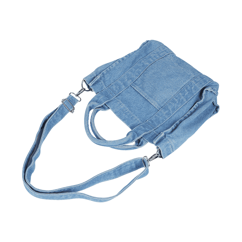 Bandolera y bolso de mano de mezclilla azul